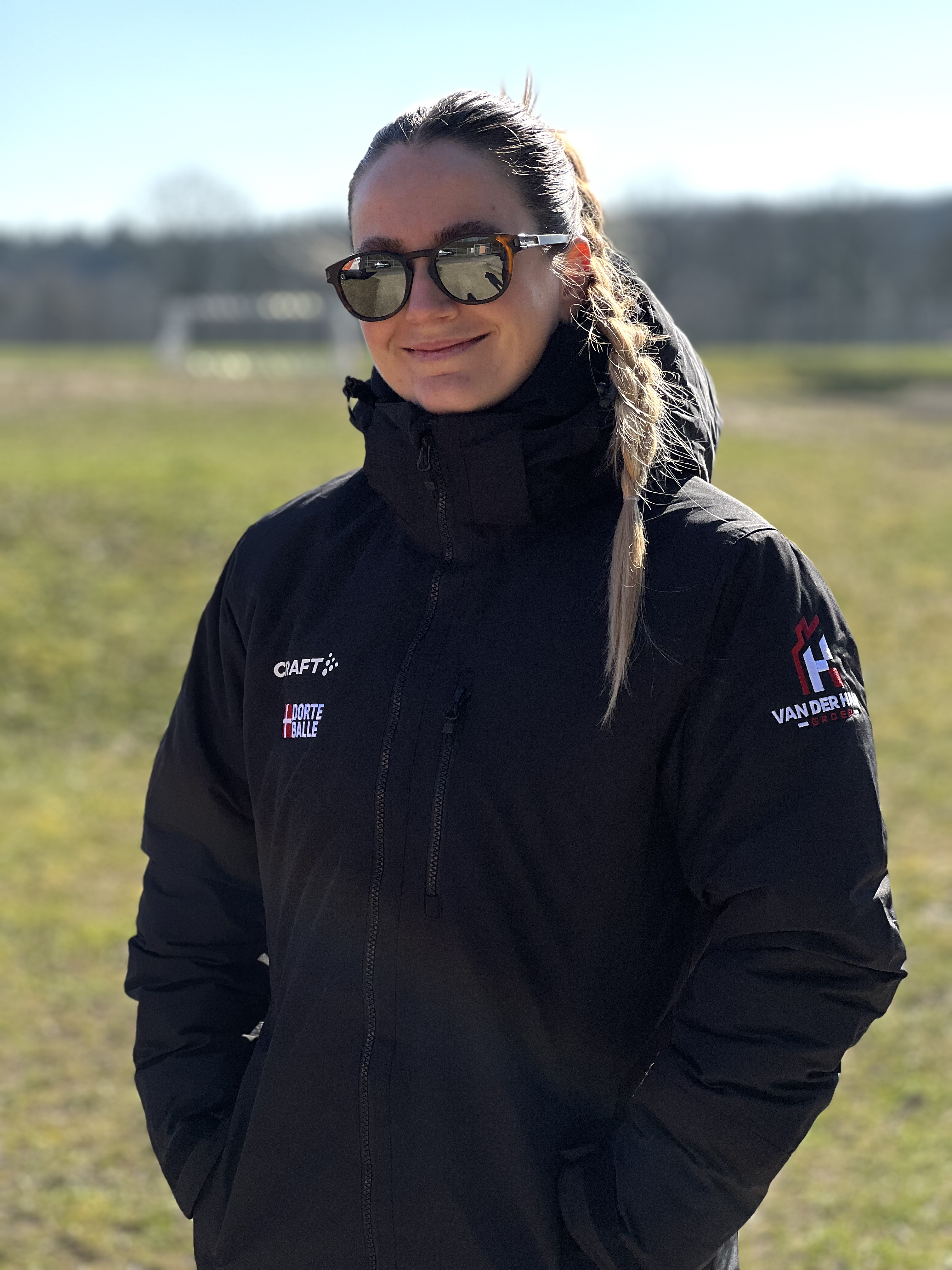 Dorte Balle smiling in her team jacket
